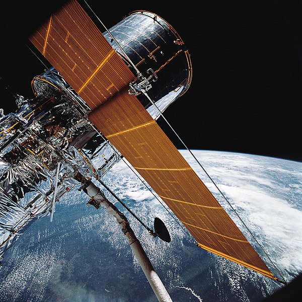 Hubble_Space_Telescope_Grappled_by_Shuttle_Arm